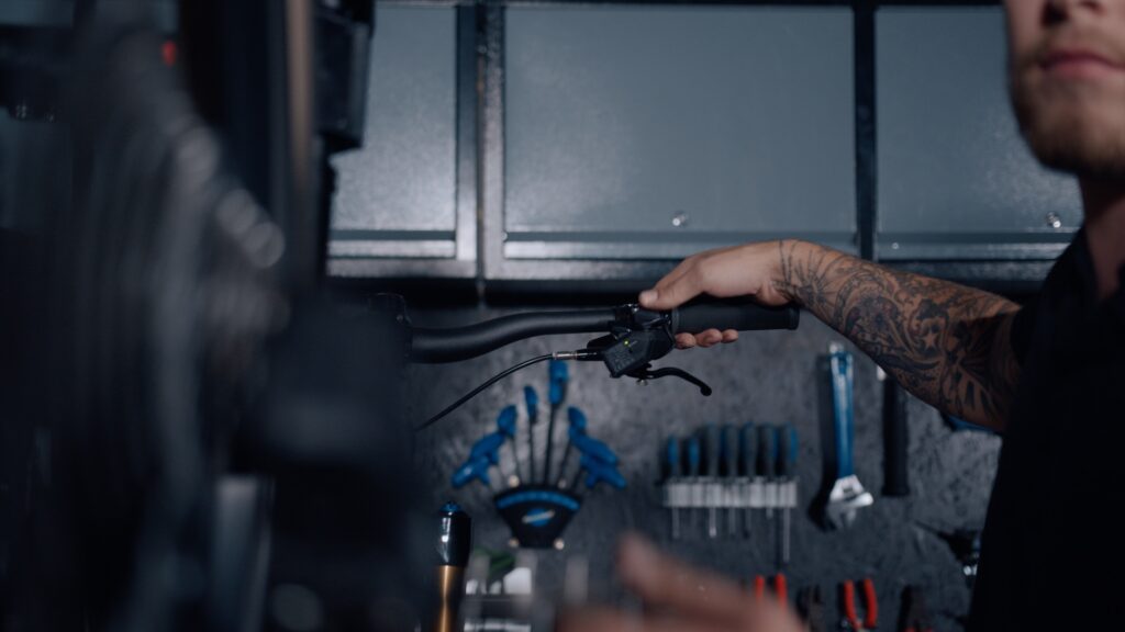 bike mechanic prepping bicycle for winter